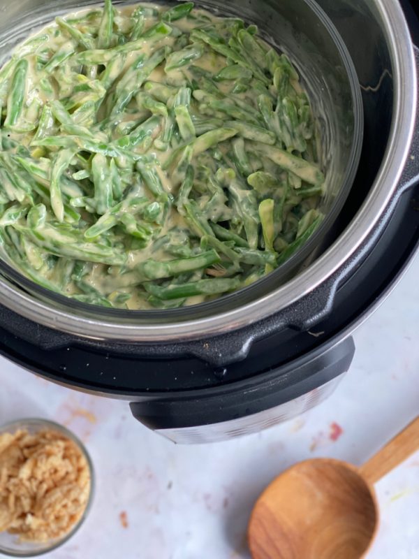 instant pot with green bean casserole fried onions and spoon