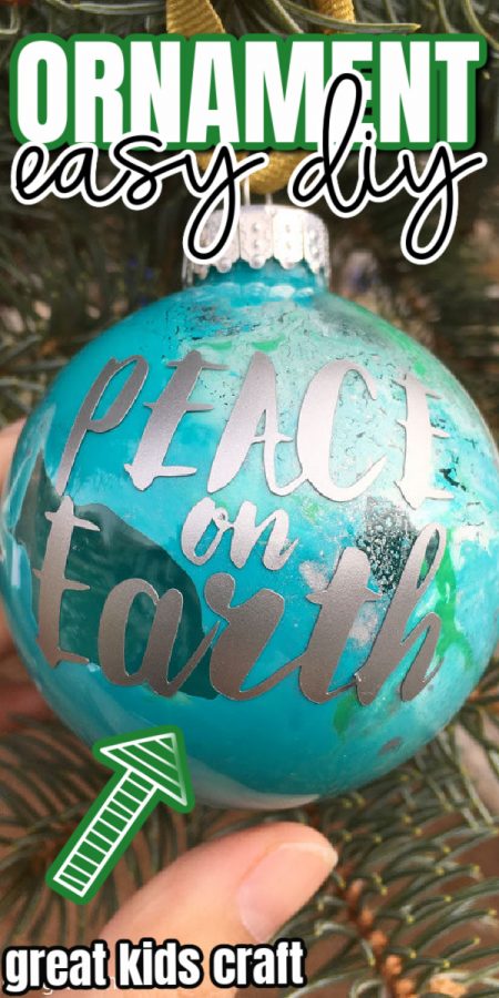 hand holding glass earth ornament