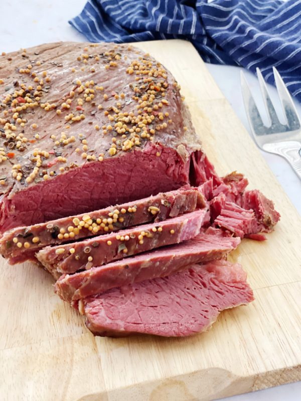 sliced corned beef roast on cutting board