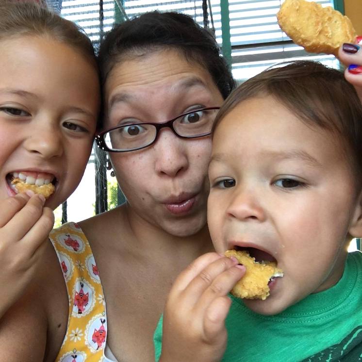 Family eating McDonald's chicken nuggets