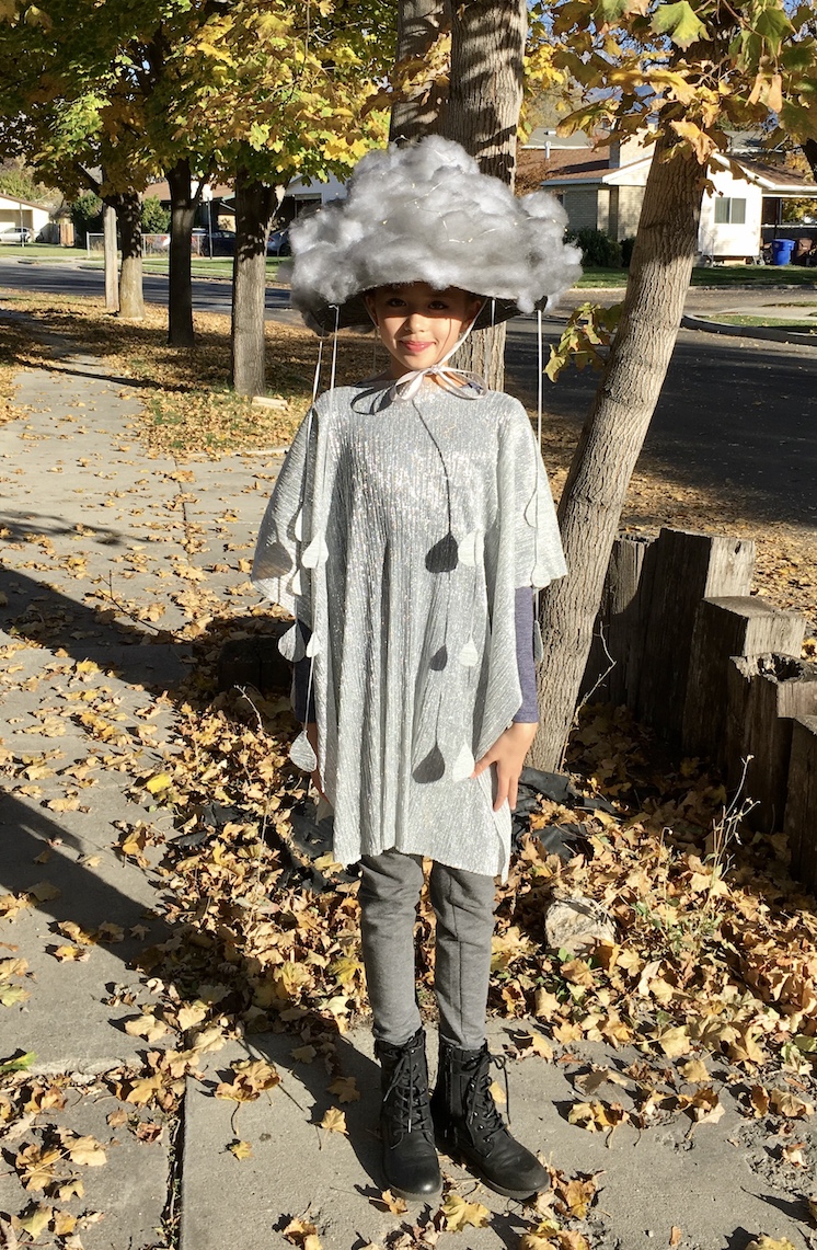 girl in cloud costume with rain cloud hat