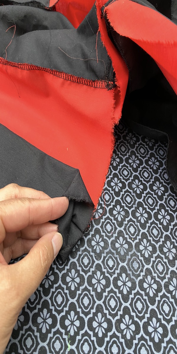 red and black fabric pleated to make cheerleader skirt