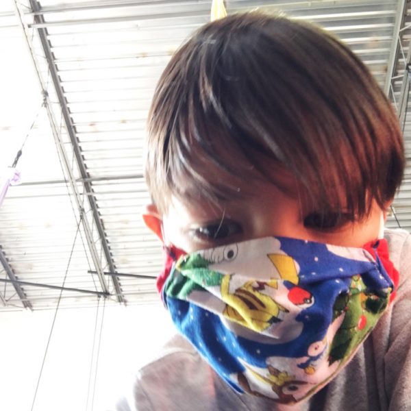 boy wearing 3D face mask origami box style