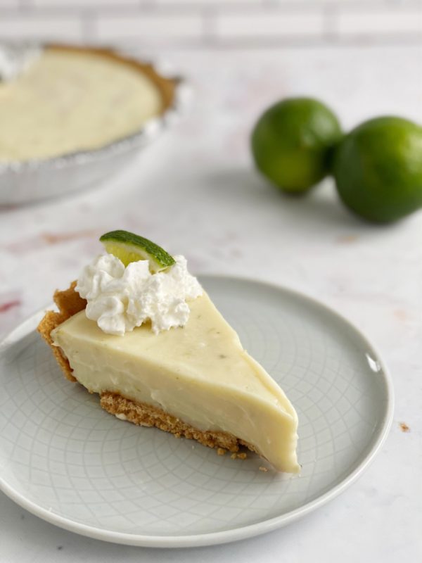 Slice of key lime pie with whipped cream