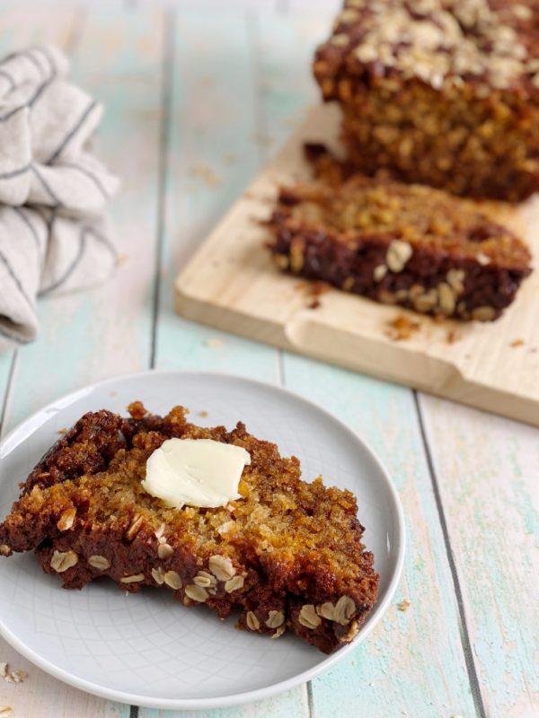 slice of banana oat bread with butter
