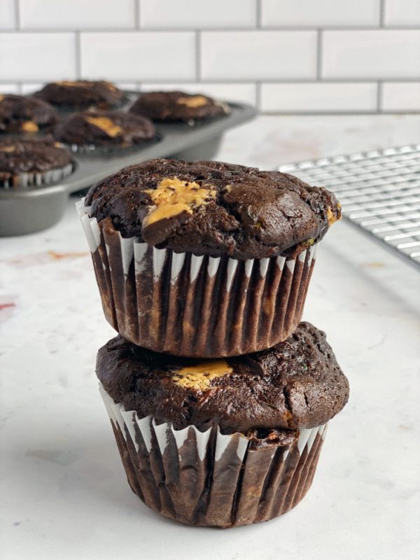 stack of chocolate peanut butter muffins