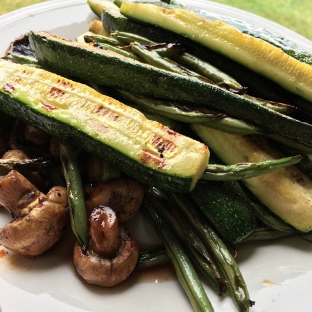 grilled zucchini mushrooms and green beans on plate