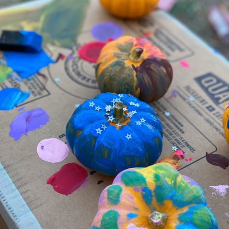 mini pumpkins painted on box with acrylic paint