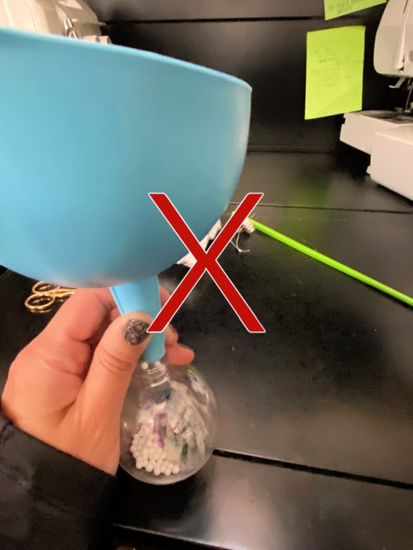 funnel ornament with X over it