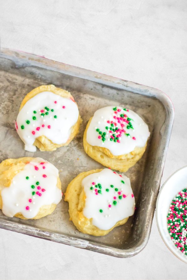 pink and green sprinkle cookies on baking sheet