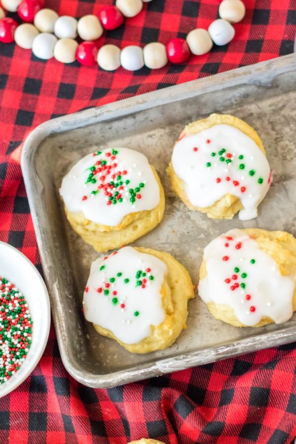 baking sheet with Christmas ricotta cookies with red and green sprinkles