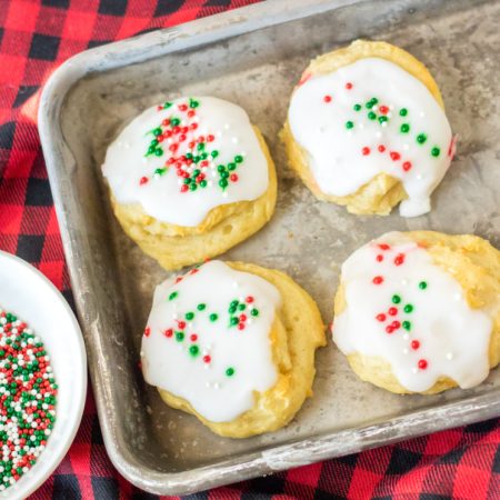 sprinkle glazed ricotta cookies on cookie sheet