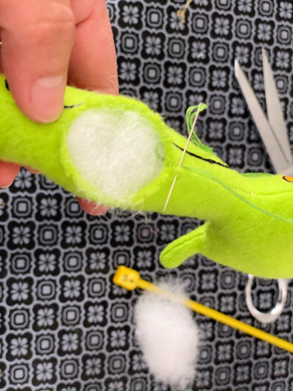 sewing closed a hole of a stuffed animal