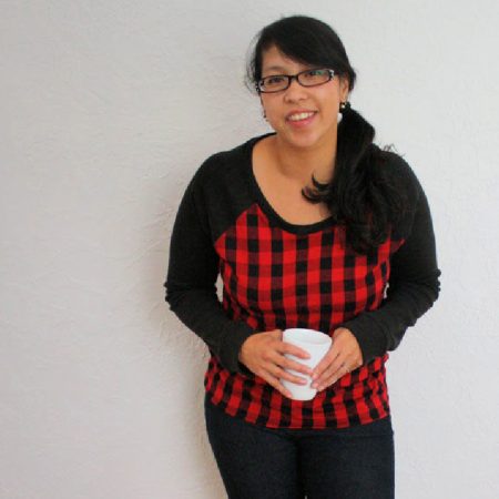 woman wearing red and black buffalo plaid shirt